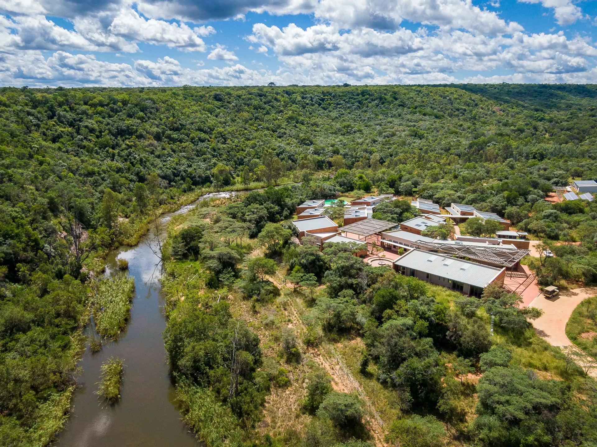 The Lapalala Wilderness School from the air, its buildings among dense bush beside the Palala River.